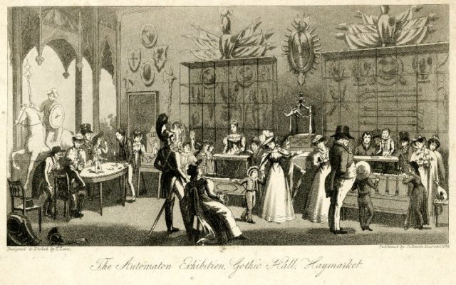 This is a scanned image of a print made by Theodore Lane (1800 - 1828) and published in 1826 by Charles Smith (1800 - 1852). The print depicts the Automaton Exhibition at Gothic Hall in Haymarket section of London. The scan of recto type was presumably done by The Trustees of the British Museum on an unknown date.