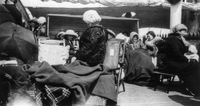 Survivors huddle for warmth on the deck of the Carpathia. Photo Credit