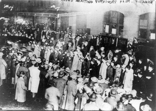 The crowd at the doors of the Cunard Line’s Pier 54, where the ship Carpathia had arrived with survivors of the Titanic disaster aboard. Photo Credit