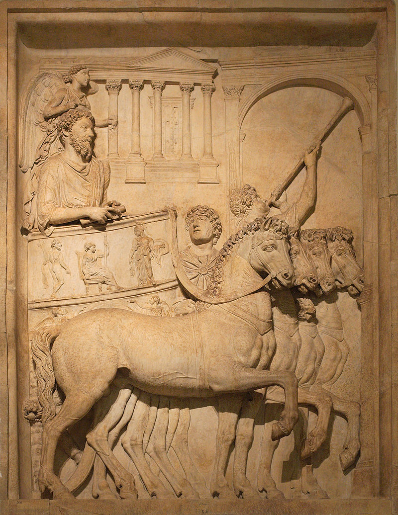 Panel from a representation of a triumph of the Emperor Marcus Aurelius; a winged genius hovers above his head. Photo Credit