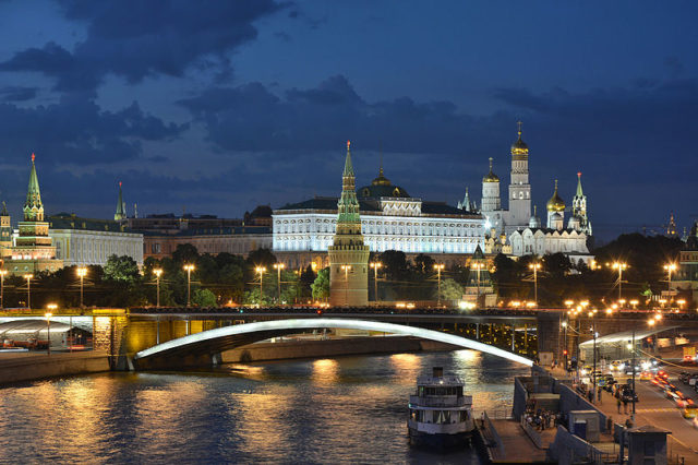 Moscow Kremlin and Bolshoy Kamenny Bridge in the late evening. Photo Credit