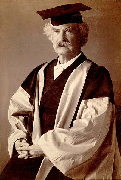 Mark Twain in his gown (scarlet with gray sleeves and facings), for his D.Litt. degree, awarded to him by Oxford University.