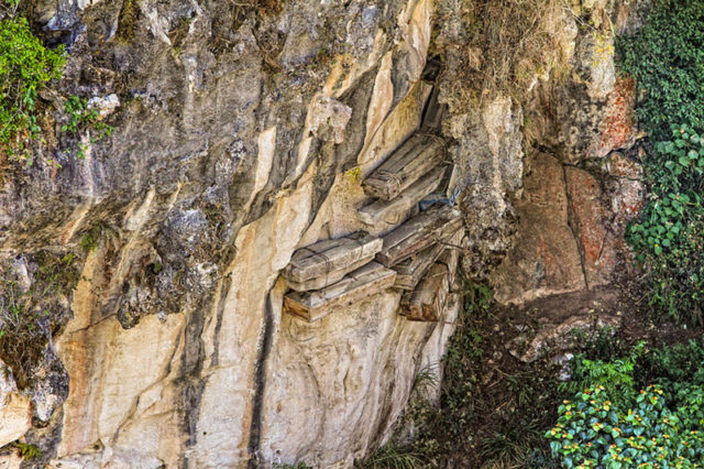 Hanging coffins on the limestone cliffs of Sagada, Philippines. Photo Credit