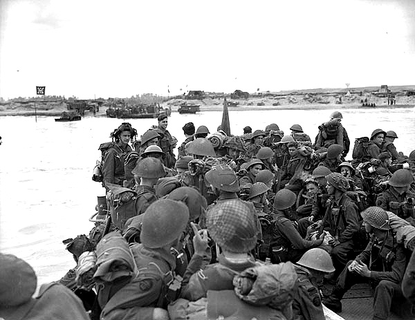 Personnel of Royal Canadian Navy Beach Commando “W” land on Mike Beach sector of Juno Beach, 6 June 1944. The beach was divided into sectors and points of attack.