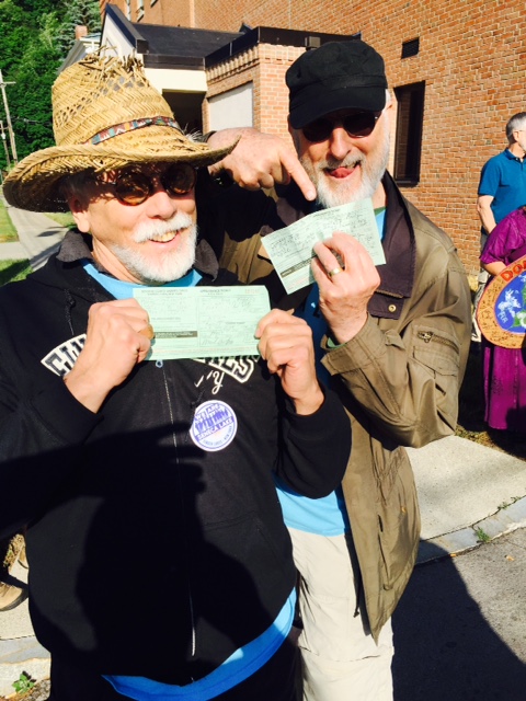 Cromwell and J.G. Hertzler show their arrest citations at the Crestwood station protest. Photo Credit