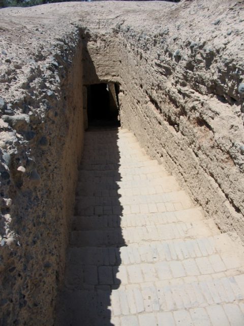Stairs leading down to an underground tomb at the Astana Graves.