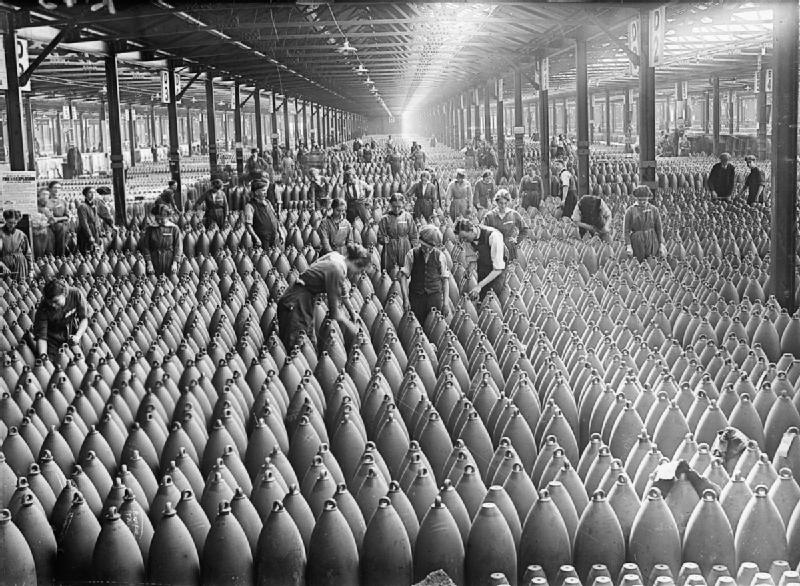 Women at work during the First World War- Munitions Production, Chilwell, Nottinghamshire, England, Uk, c 1917 A general scene showing workers, both male and female, amid rows and rows of shells in a large warehouse at the National Filling Factory, Chilwell