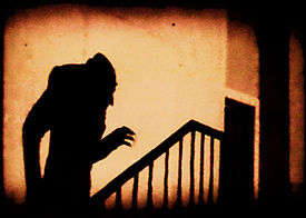An iconic scene of the shadow of Count Orlok climbing a staircase