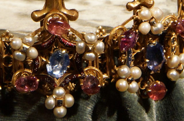 Detail of the circlet. Two of the rings surmounted with hexagons, with alternating arrangements of jewels and pearls. Photo Credit