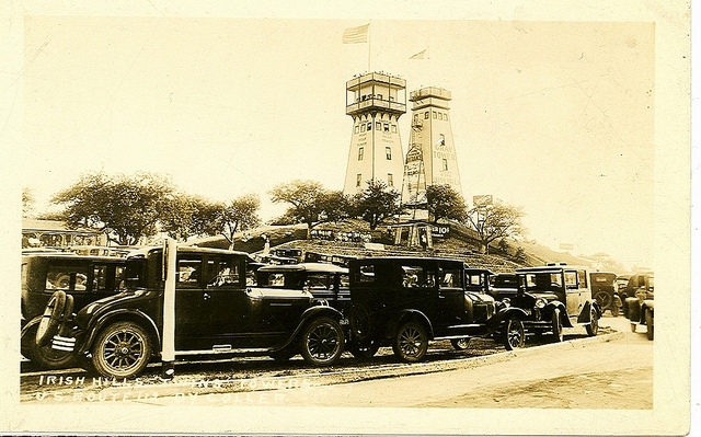 Irish Hills Towers, with 1920s cars in foreground. Photo Credit