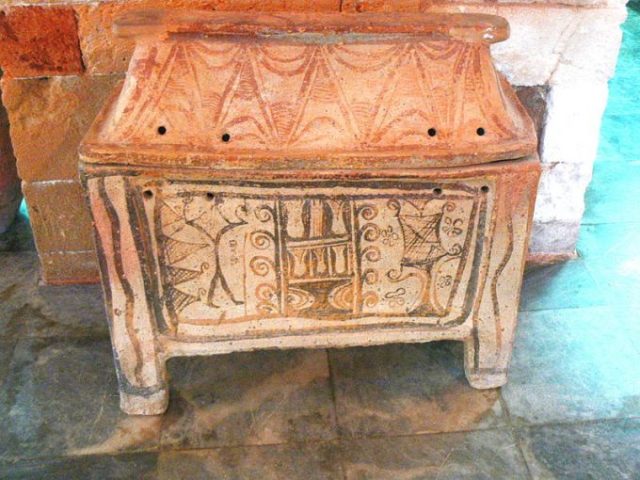 The larnax or sarcophagus, a clay burial container Photo Credit