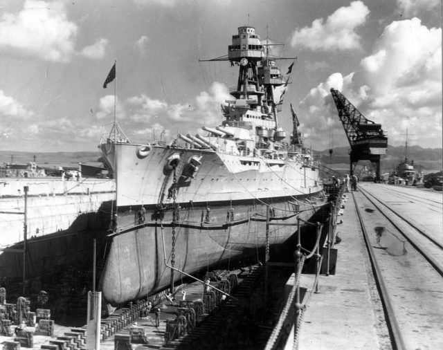 The USS Nevada drydocked at the Pearl Harbor Navy Yard, circa 1935. Launched in 1914, Nevada was regarded as a highly advanced dreadnought ship with triple gun turrets, using oil instead of coal for fuel, geared steam turbines for greater range, and the “all or nothing” armor principle.