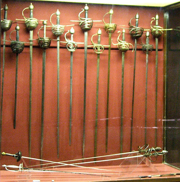 Rack displaying rapiers and swords commonly used in the 16th and 17th century Photo Credit