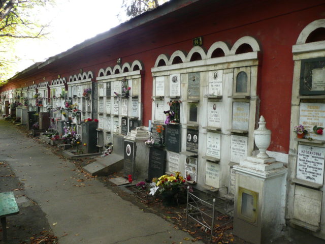 The wall of the cemetery is used as a columbarium   Photo Credit