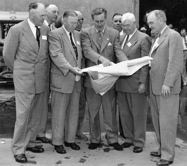 Walt Disney (center) showing Orange County officials plans for Disneyland’s layout, December 1954. Photo Credit