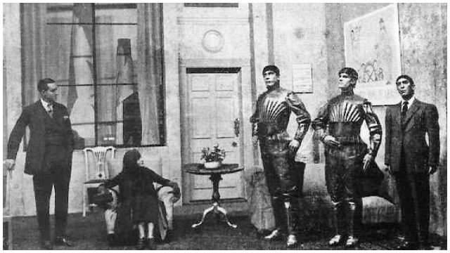 A scene from “R.U.R.,” showing three of the robots