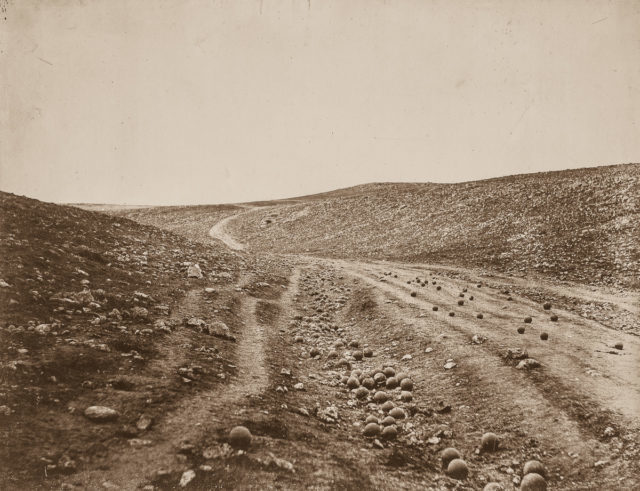The Valley of the Shadow of Death, a heavily shelled corridor on the road to Sevastopol. The cannonballs on the road were moved there, likely by the photographer.