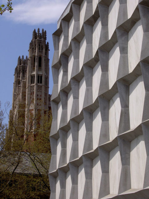 Beinecke’s starkly geometric exterior, with the Yale Law School’s Gothic spires in the background.