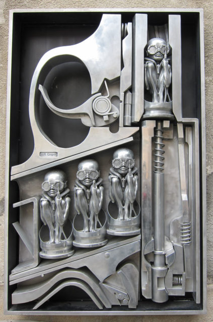 “Birth Machine,” Giger’s sculpture exhibited in the H. R. Giger Museum in Gruyeres, Switzerland.Author: Matěj Stuchlík  CC BY 3.0,