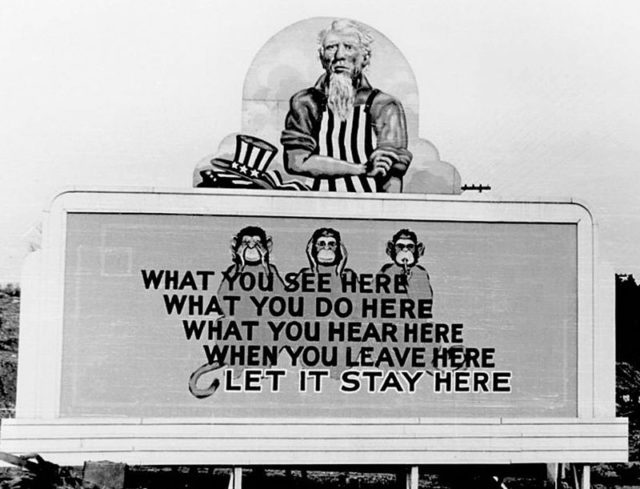 A World War II poster directed at participants in the Manhattan Project.
