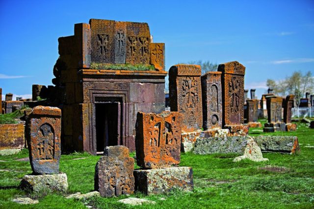 A tomb surrounded by khachkars. Author:Mediacart CC By 3.0