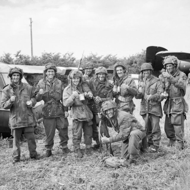 Members of 12th Parachute Battalion, 5th Parachute Brigade, 6th Airborne Division, enjoy a cup of tea after fighting their way back to their own lines near Ranville after three days behind enemy lines, June 10, 1944