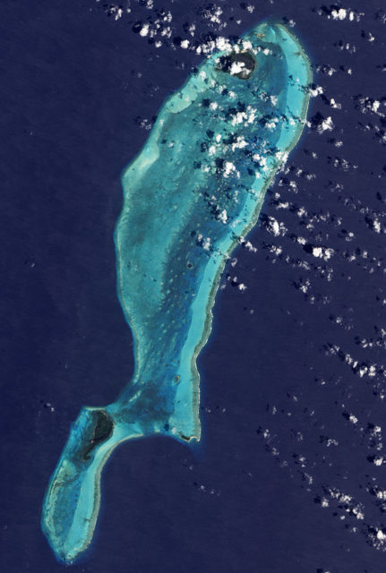 Lighthouse Reef as seen from space. The Great Blue Hole is near the center of the photograph.