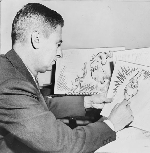 Dr. Seuss at work in 1957 on a drawing of the Grinch for How the Grinch Stole Christmas!.