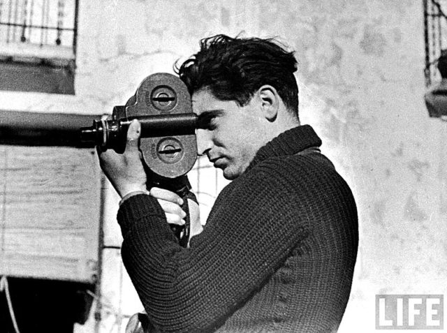 Capa on assignment in Spain, using a Filmo 16mm movie camera. Image by Gerda Taro.