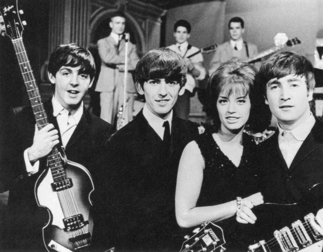 McCartney, Harrison, Swedish pop singer Lill-Babs and Lennon on the set of the Swedish television show Drop-In, 30 October 1963