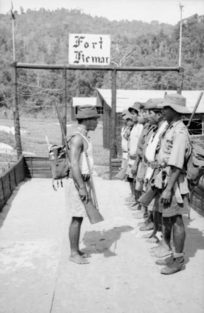 Local guards from the Senoi tribe at Fort Kemar, one of a chain of posts in the heart of the central mountain range of Malaya, 1953.