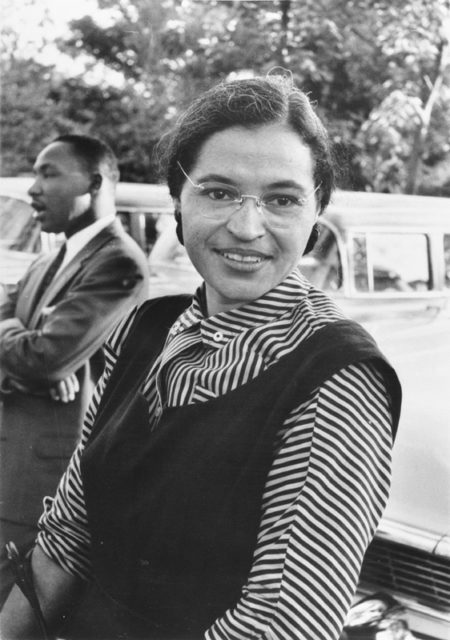Photograph of Rosa Parks with Dr. Martin Luther King, Jr. in the back.