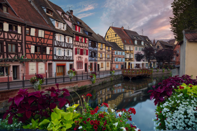 Cityscape image of old town Colmar, France during sunset.