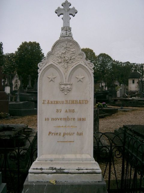 Rimbaud’s grave in Charleville. The inscription reads Priez pour lui (“Pray for him”) CC BY 2.5