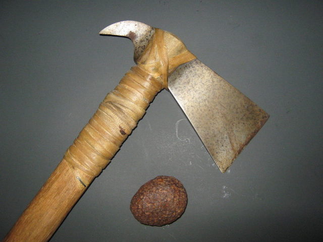 An iron meteorite found on Fox Island, near Seward Alaska. The hatchet was forged from a similar meteorite, and the remnants of the Widmanstatten structures are visible in the blade.