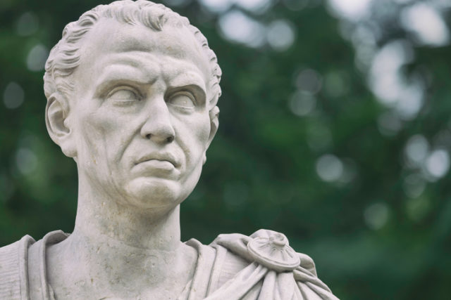 A sculpture of the roman emperor Julius Caesar near the old orangery in the public Lazienki Park, Warsaw. The sculpture was made by Franciszek Pinck (1733-1798).