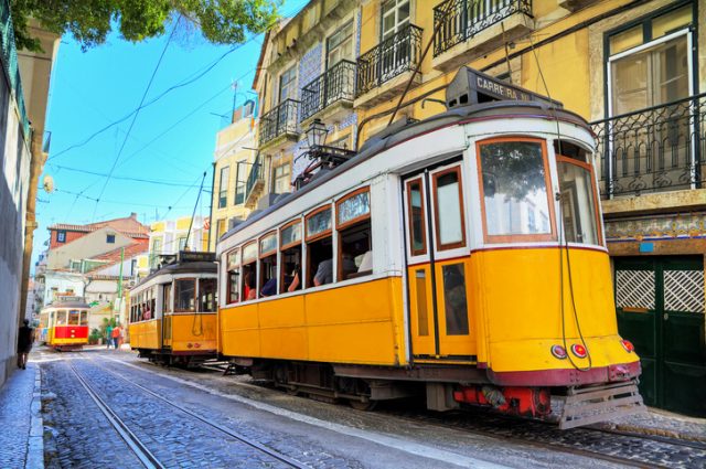 Traditional yellow trams in Lisbon, Portugal