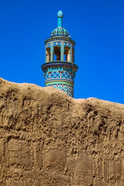 The last resting place of Shahzade Ibrahim Mausoleum. A lofty tiled minaret springing out into the Kashan sky