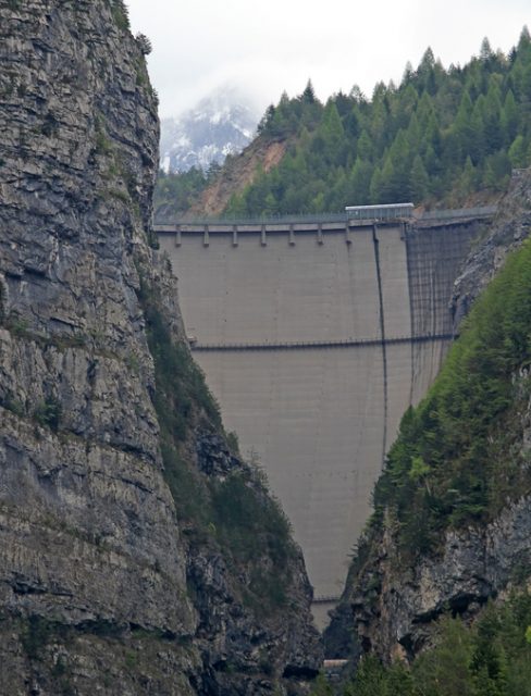 imposing the vajont dam of reinforced concrete between two mountains in Italy
