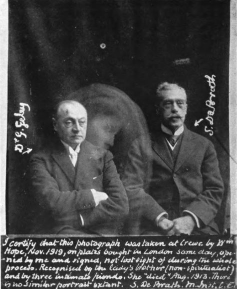 The psychical researchers Gustav Geley and Stanley De Brath with an alleged spirit. Photograph taken by William Hope in November, 1919.