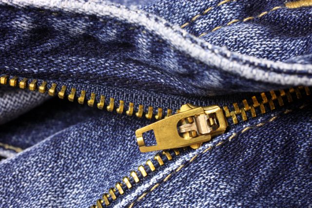 Zipper on blue jeans, closeup