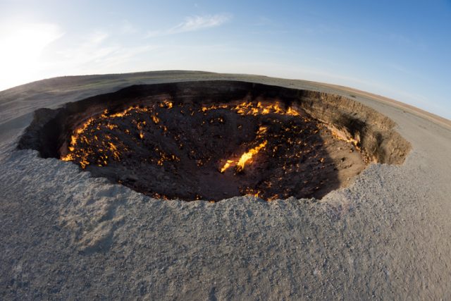 The Darvaza Gas Crater in Turkmenistan. Gas coming from the ground is burning in the crater. The diameter of the hole is about 70 m.