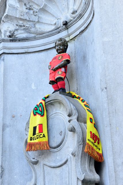 Brussels, Belgium – March 7, 2014: Manneken Pis is a landmark small bronze sculpture and national symbol of in Brussels, made in 1619 by Hieronimus Duquesnoy.