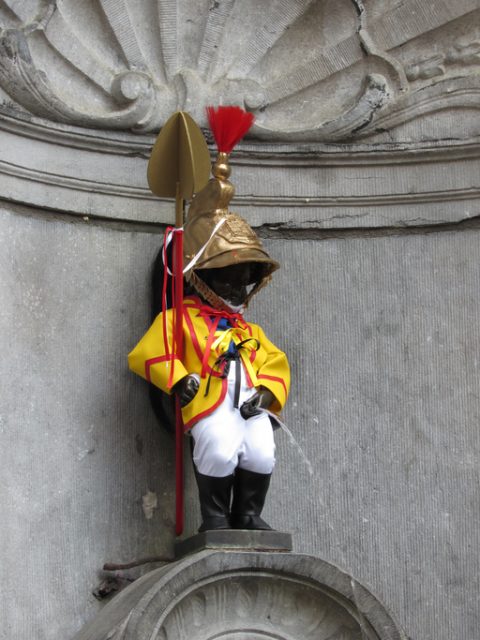 Manneken Pis statue dressed as a soldier in Brussels