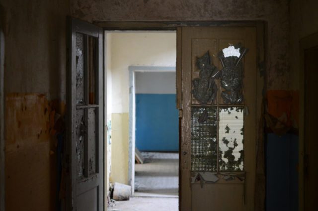 Ruined doors inside the military compound – Author: marcus.liefeld – CC BY 2.0
