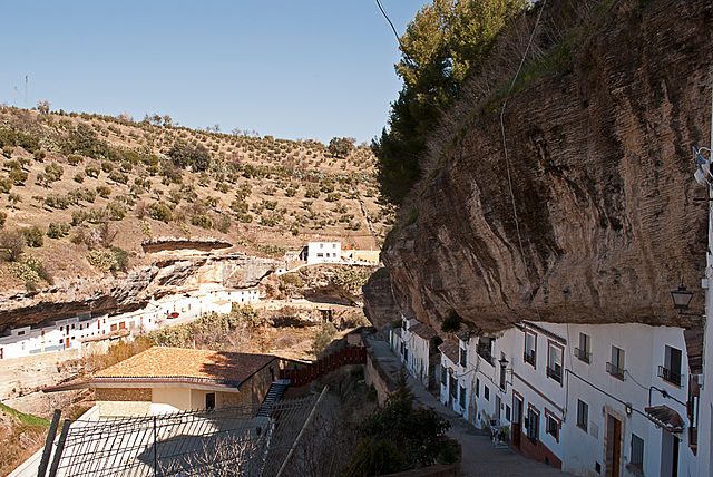 Most amazingly, one large overhang covers an entire block of white houses, providing shade and natural cooling during warm summers in southern Spain. Author Anual, CC BY-SA 3.0
