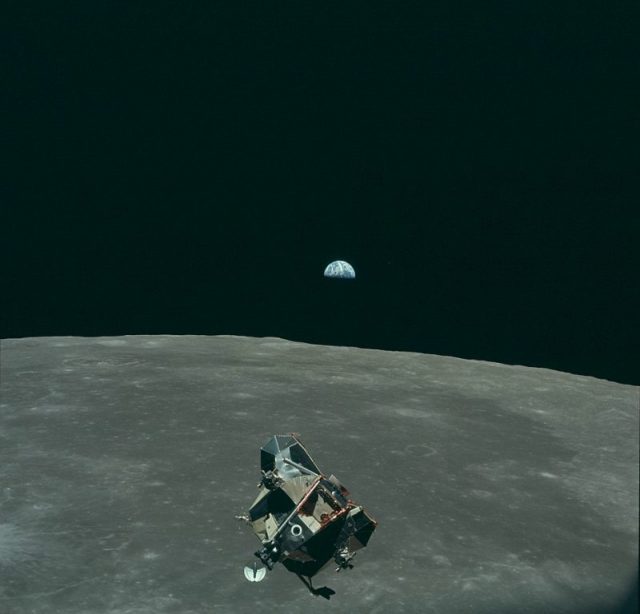 Earth, Moon, and Lunar Module, in lunar orbit after return from the moon and before rendezvous with the Apollo 11 Command/Service Module.