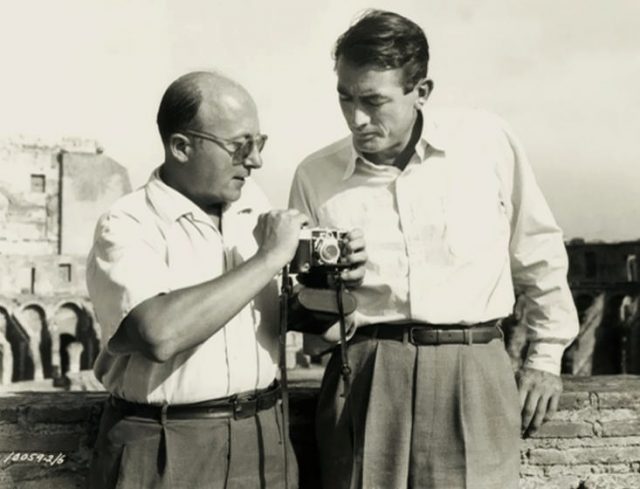 Cinematographer Franz Planer & Gregory Peck on the set of Roman Holiday – publicity still