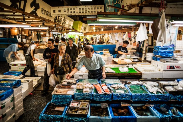Buyers and sellers at the Tsukiji Fish Market in Tokyo. With an estimated annual turnover of $5.5 billion and more than 60,000 workers, this is the biggest wholesale and seafood market in the world.
