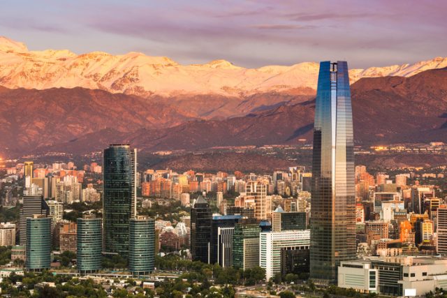Skyline of Santiago de Chile at the foots of The Andes Mountain Range and buildings at Providencia district.